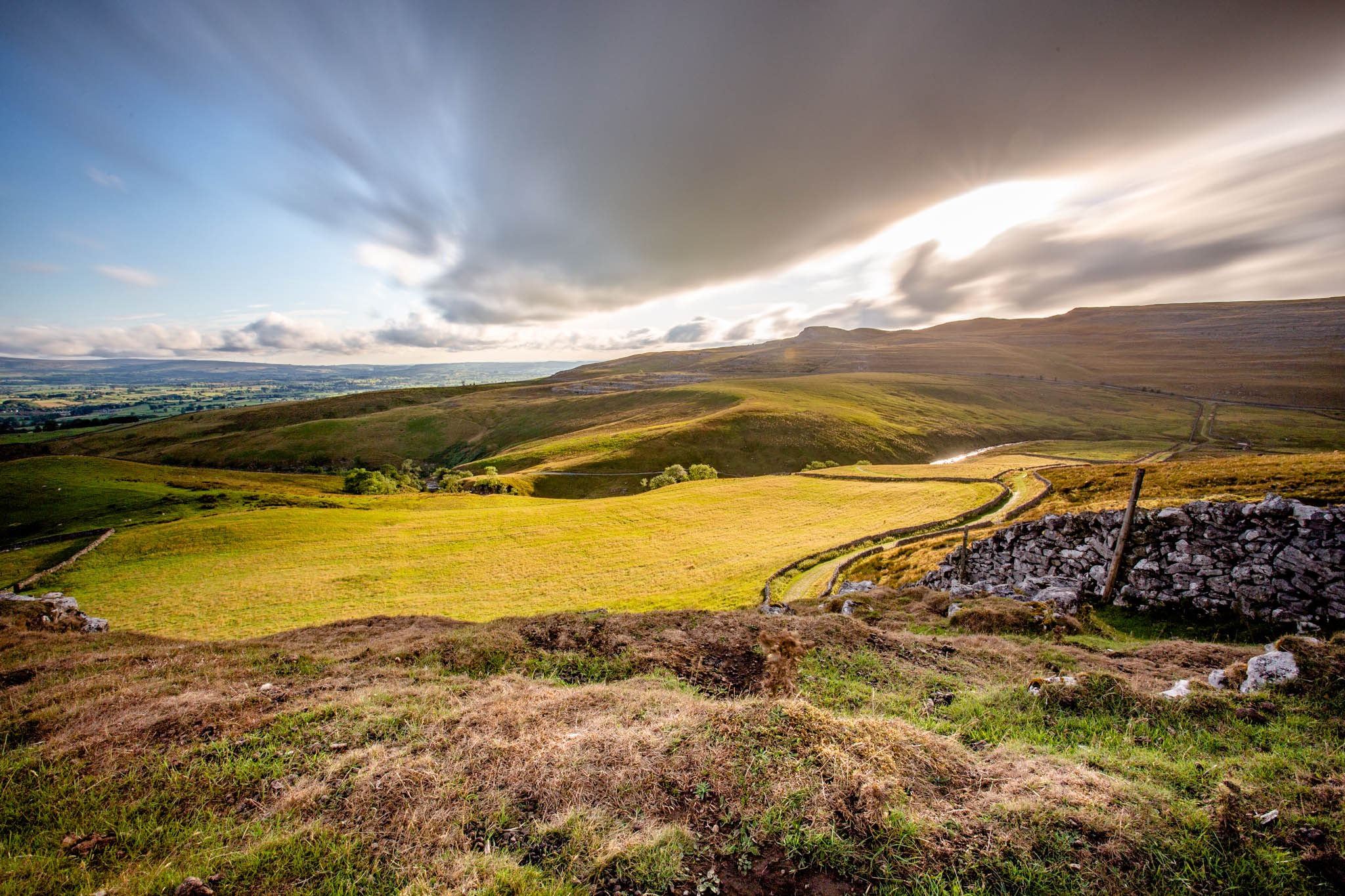 IMG_7132 (1) Landscape of a field with dramatic clouds