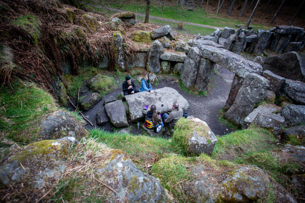 people at a stone table